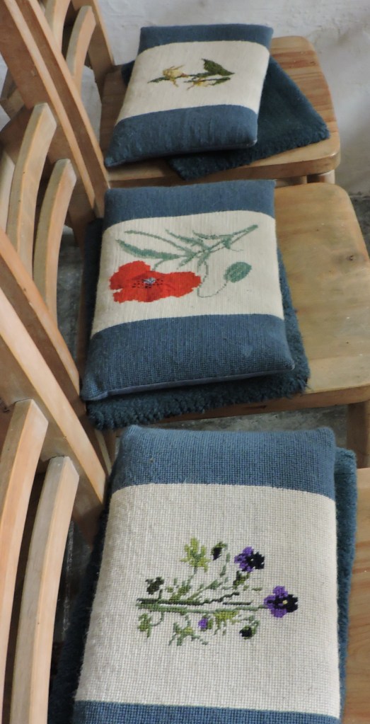 A selection of the kneelers from the Lady Chapel - embroidered with wild flowers